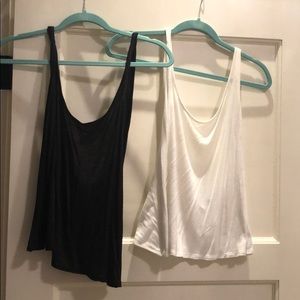 Two Daydreamer LA black & white back-cross tanks